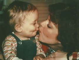 Toddler Amy and Mom kiss